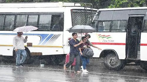 Water is dripping from the roof…. Windows are broken, passengers are travelling in the bus wearing umbrellas and raincoats in the rain